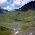 View of tarn and backcountry from 1st glacier