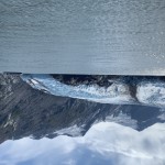 View of the glacier at the lake, with the ferry in view